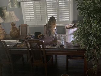 Wooden Dinning Table with 2 Leafs To Extend. 6 Re Upholstered Chairs. Solid Wood. Very Nice.