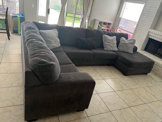 Grey living spaces sectional couch