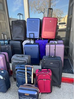 Assorted damaged luggage