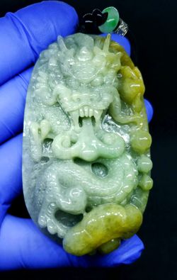 Burmese icy type A jadeite jade pendant lucky Dragon spit fire. Certified.