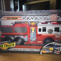 🆕️LARGE FIRE TRUCK. SPRAYS WATER, MAKES SOUNDS, DOORS OPEN, MOTORIZED, LIGHTS UP, AND LADDER  OPENS. AND SWIVELS.