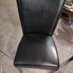 Four Dinning Room Chairs And A Glass Top