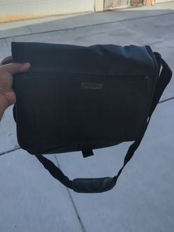 Kenneth Cole crossbody bag with shoulder strap.