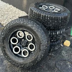 set of tires along with wheels, black rhino