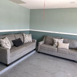 Beautiful two large grey sofas same size in great condition asking 450pillows Not Included