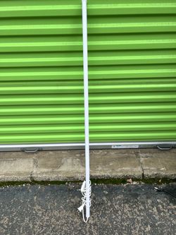 Set of 5 - 5 foot long, thin, white tubular LED shop light or work light with an attached power cord and standard two-prong electrical plug.