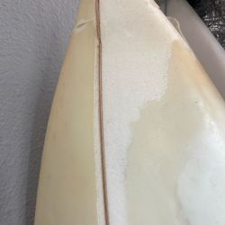 buckled lost surfboard