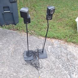 Bose speakers black with stands And to speakers without stands four speakers to all Together