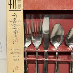 This item is a 46-piece stainless steel flatware set by Gibson, designed to serve 8 people.