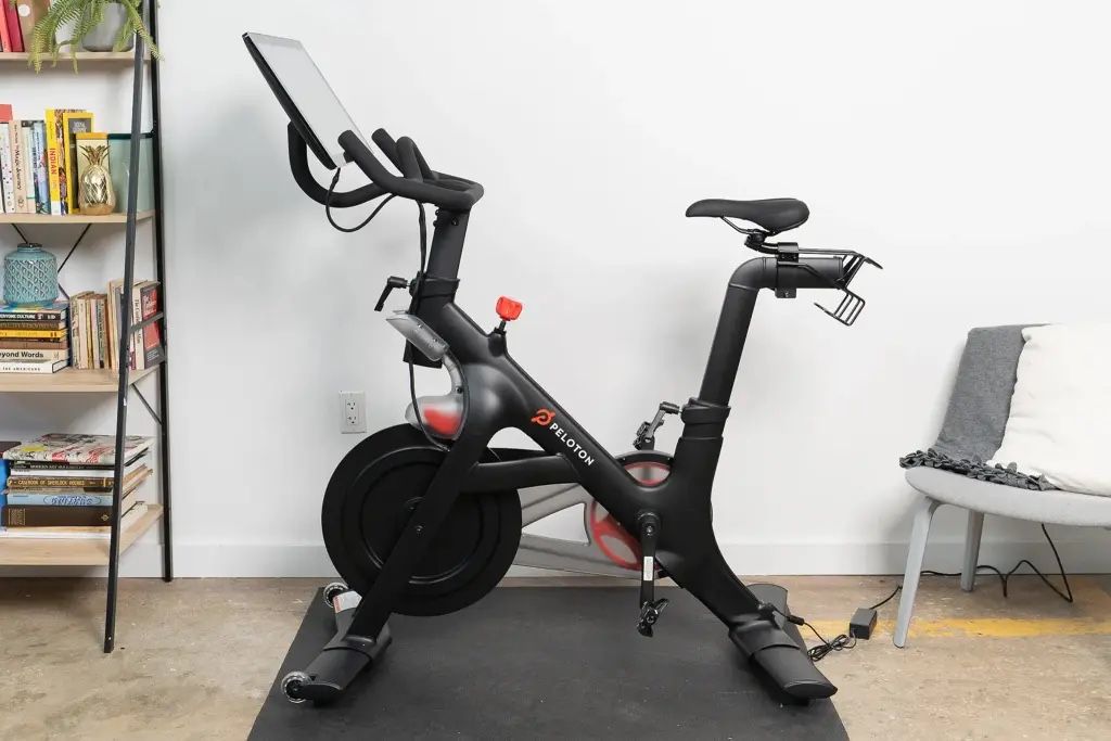 Peloton W/ Riding Shoes And Hand Weights