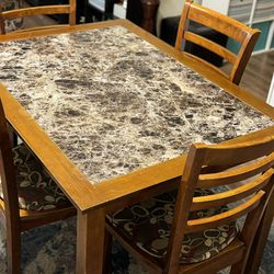 Dining table and chairs with free cushions 