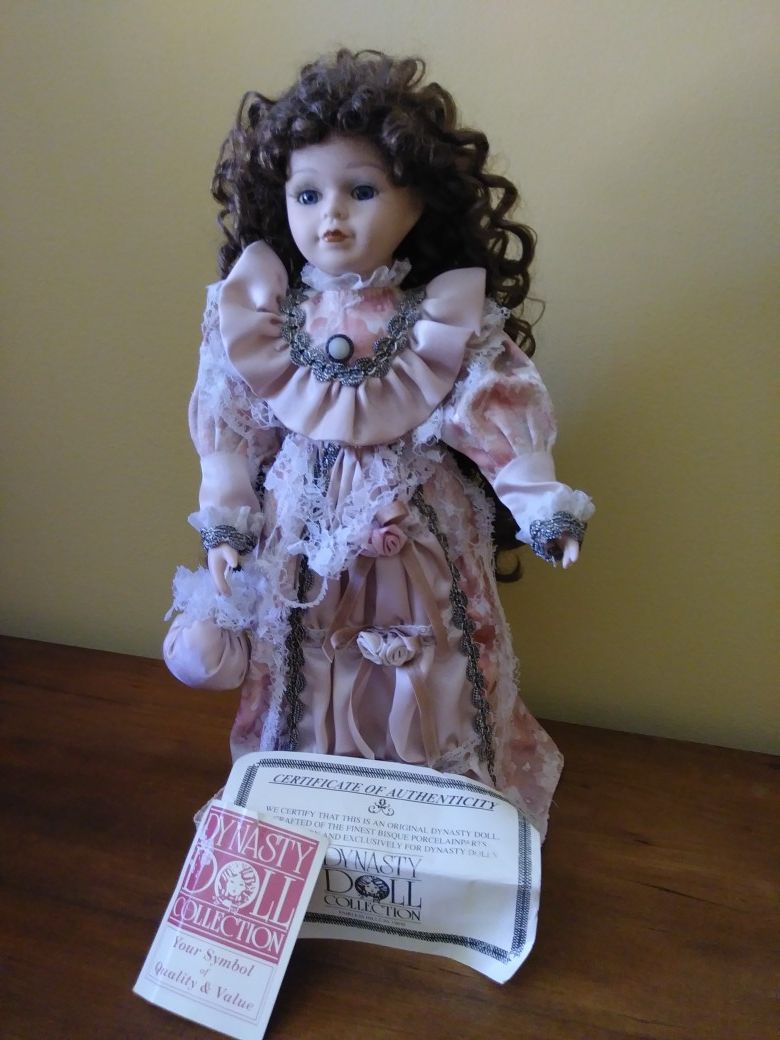 Vintage Dynasty Doll Collection Doll. Long curly hair. Some of ribbon is broken.