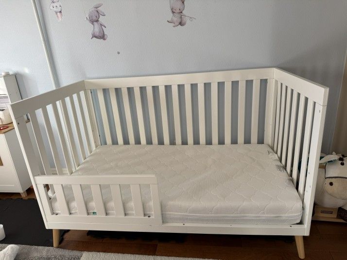 Delta Essex 4-in-1 Convertible Crib — Bianca White + Natural Legs