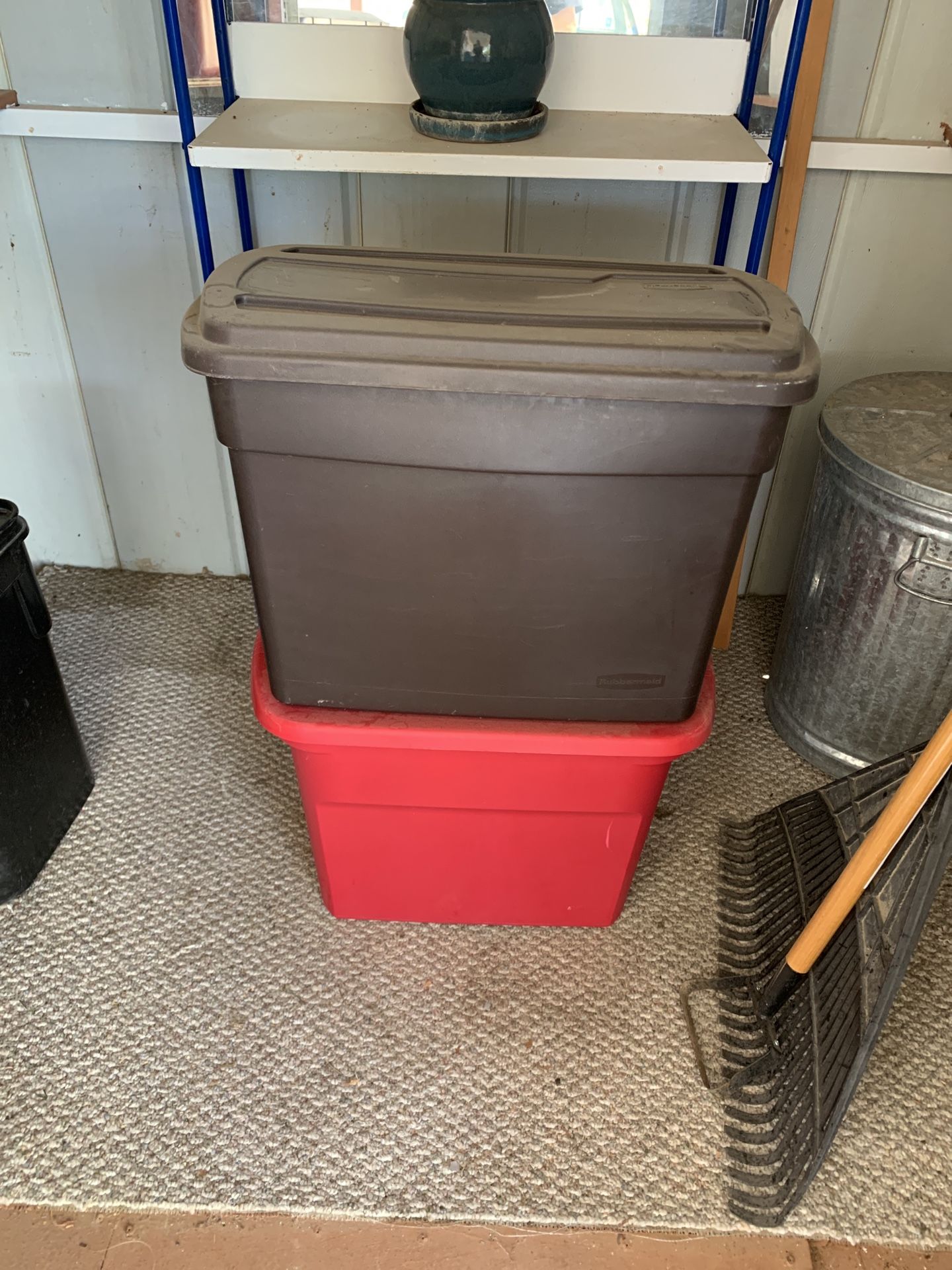 Two storage tubs with lids in good condition