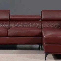 Red leather sectional sofa and ottoman 
