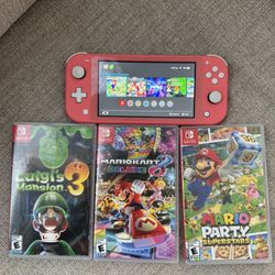 Pink Nintendo switch with games