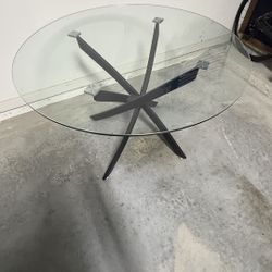 Signature Design by City Furniture Modern Glass Tabletop Dining Table with Cross-Shaped Base, Black 