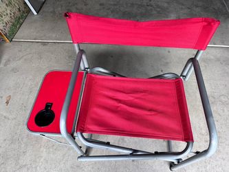 portable folding outdoor director's chair with a flip-up side table.