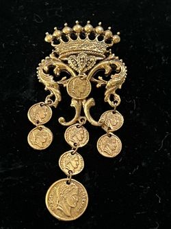 Vintage 1960s Arthur Pepper (signed "Art") brooch features a gold-tone crown design dangling with seven Napoleon Empereur coins.