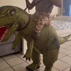 Inflatable dinosaur ride-along