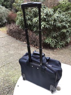 Briefcase – carry-on, with wheels, retractable handle, like new