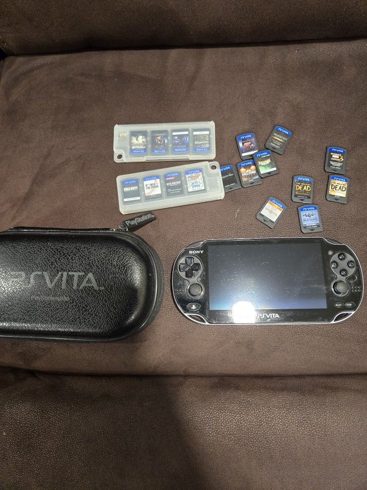 PS.Vita ,case , memory Cards And 24 Games