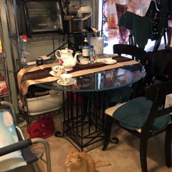 Cast iron stand and glass beveled glass table for sale