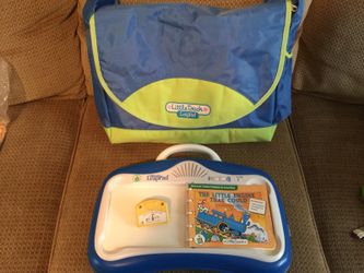 Leap Frog Little Touch baby tablet with one game and book in great used condition. Has another game but is missing book