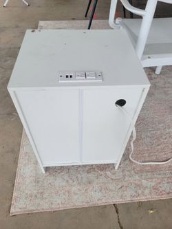 Small night stand with plugs