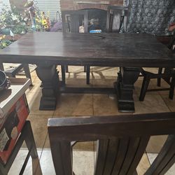 Solid oak wood kitchen table sits 10 but has 6 kitchen chairs