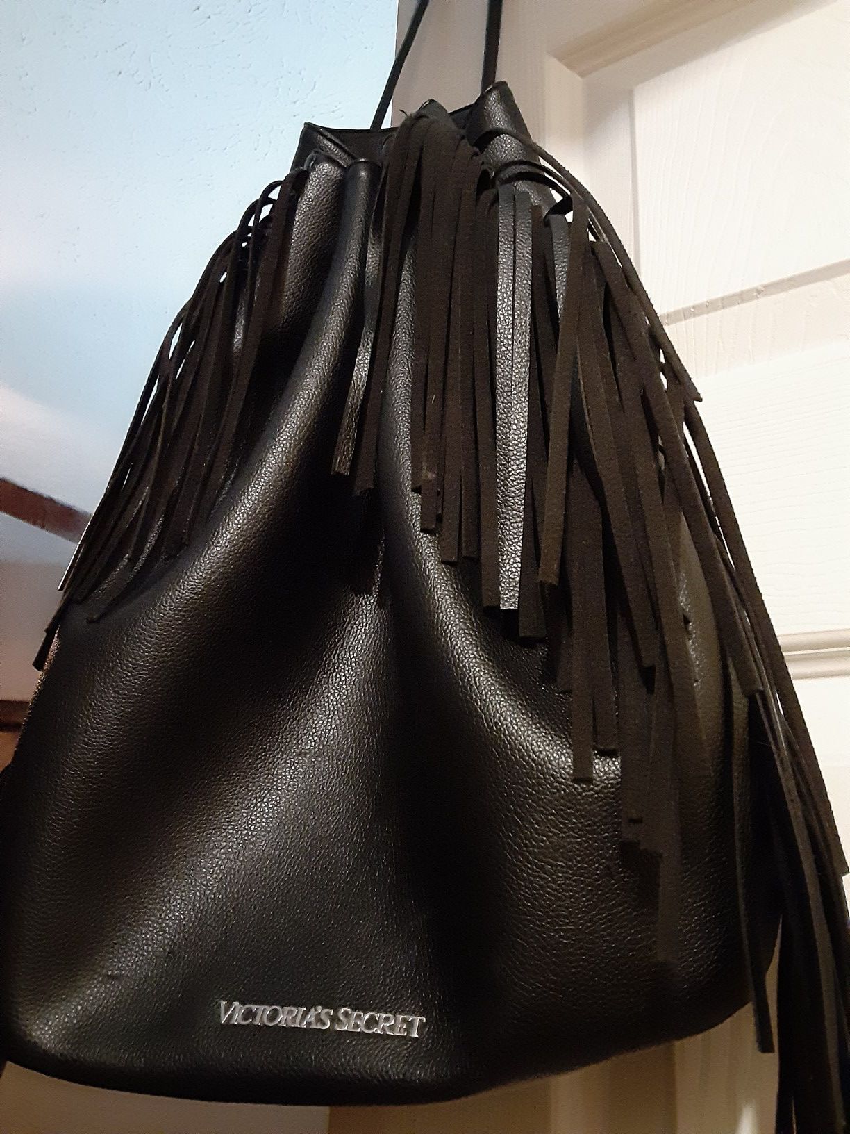 Victoria Secrets black fringed leather backpack