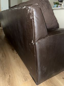 Leather base sofa black with brown cushions, model unknown