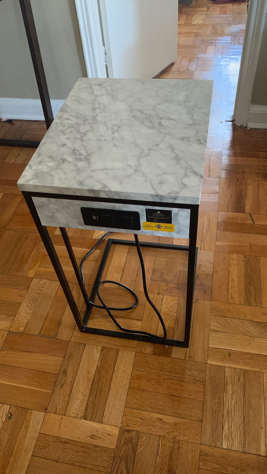 Marble side table with outlets connected