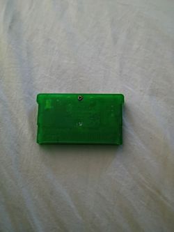 Pokemon emerald version game cartridge with Nintendo DS lite