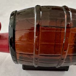 Vintage Avon Unused "On Tap" amber glass decanter  whiskey or beer barrel shape featuring a red plastic spigot