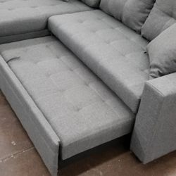 Small reversible sofa chaise sectional with a pullout bed