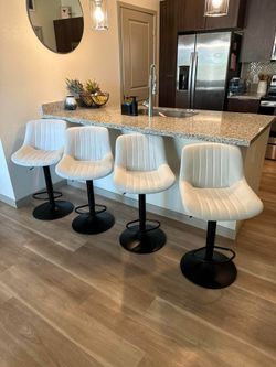 Three Matching Swivel Barstools