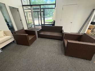 Brown whicker patio seating area set