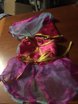 XS dog dress can be used for princess costume too new. $15 Unused. Great price purple blue pink and gold accents. Super cute. Very designer.