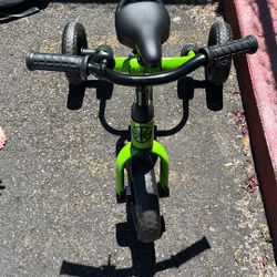 Green Bike And Jumper That Connect To Door