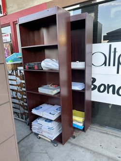 Five-shelf bookcase in a cherry or mahogany laminate finish
