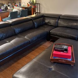 Black Sectional Couch and Matching Ottoman