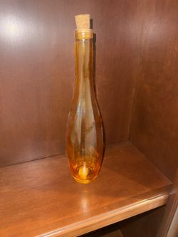 Tall decorative Amber glass bottle