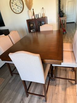Counter top level dining table with 6 chairs