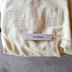 BRAND NEW 💯 AUTHENTIC FEAR OF GOD ESSENTIALS CANARY YELLOW HOODIE.  PACSUN. 