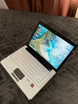 14"inch AMD Turion HP Laptop, 320GB HDD, 4GB RAM, Inbuilt Bluetooth, DVD RW 📀, SD Card Reader And a WebCam.