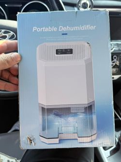 portable electric dehumidifier with a 1200ml capacity water tank