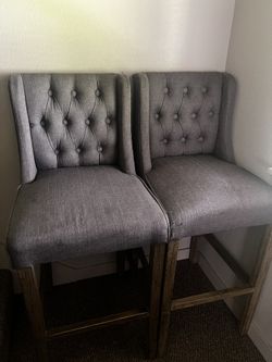 Two Grey Upholstered Linen Bar Stools