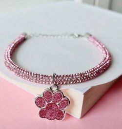 Elegant pink paw dog pendant with glittering necklace