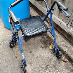 Walking Chair With Seat 20.00 new But Left Outside One Night